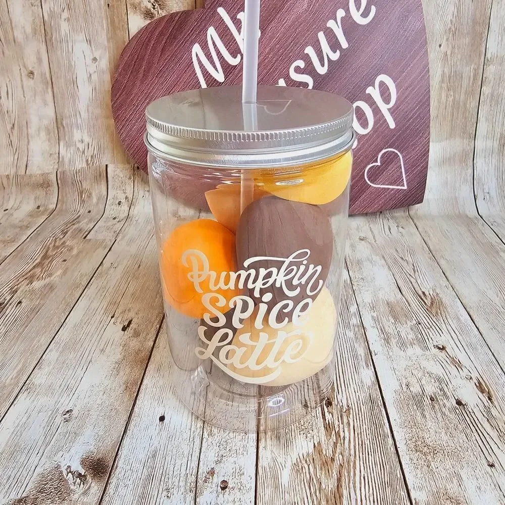Pumpkin spice latte cup with makeup sponges